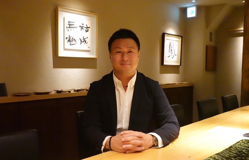 ネクストグローバル代表の時吉宏昌氏。製造業の時吉工業の代表も務める